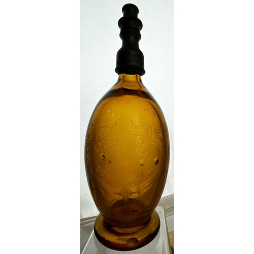 127 - DUNFERMLINE SODA SYPHON. 10.9ins tall. Extraordinary pear shape, red amber glass, wide flared foot. ... 