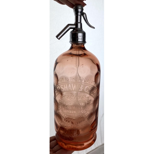 136 - WAKEFIELD LEEDS BARNSLEY & WETHERBY SODA SYPHON. 12.1ins tall,, shiny metal top, salmon pink glass, ... 