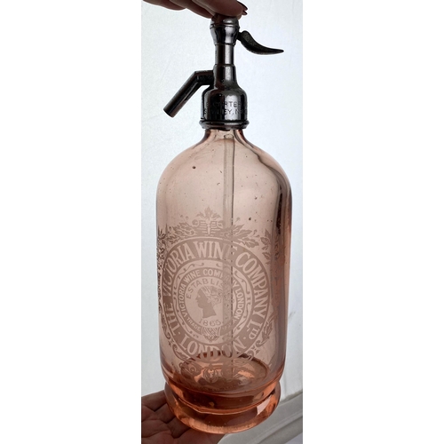 137 - LONDON PINK SODA SYPHON. 13.3ins tall, 136. salmon pink glass, shiny metal top. Elaborate acid etche... 