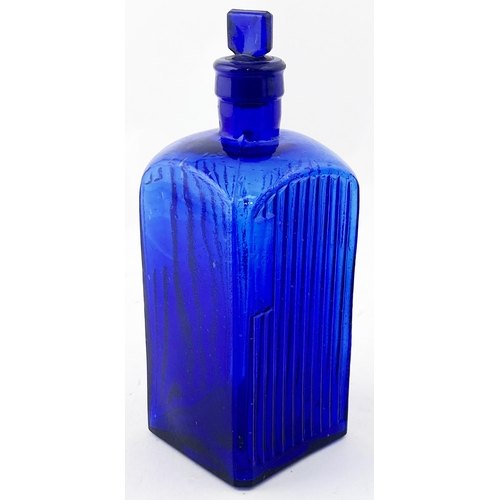 159 - ADMIRALTY POISON BOTTLE. 7.2ins tall. Vivid cobalt blue glass (crude/ whittled), square body, 3 side... 