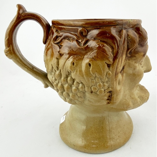 187 - SATYR JUG. 7ins tall. T.t., highly varying salt glaze, rear well modelled handled. Detailed shaped b... 