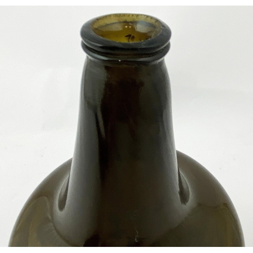 210 - ENGLISH MALLET WINE BOTTLE. 8.2ins tall, dark amber tinged green (?), c. 1725-40, thin double collar... 