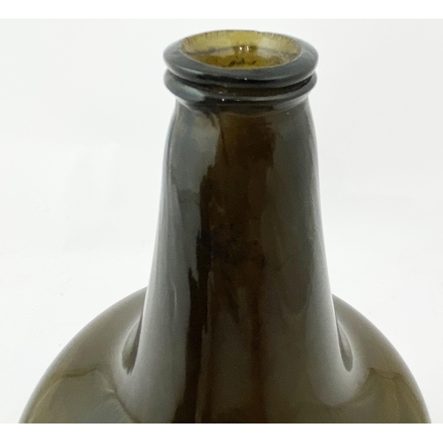 210 - ENGLISH MALLET WINE BOTTLE. 8.2ins tall, dark amber tinged green (?), c. 1725-40, thin double collar... 