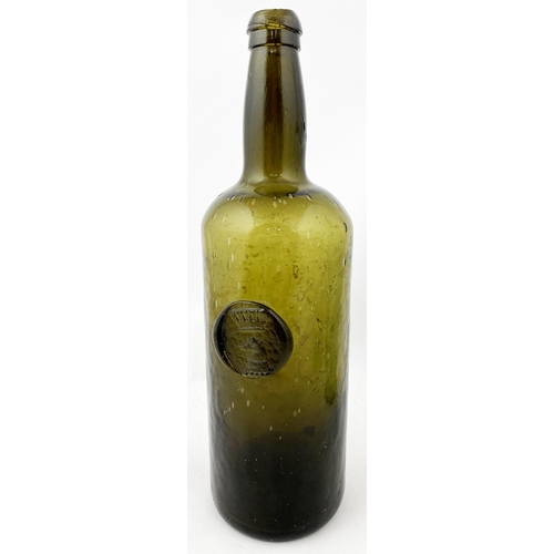 211 - SEALED CYLINDER WINE BOTTLE. 11ins tall. Deep olive green/ black glass, rounded shoulders, double co... 