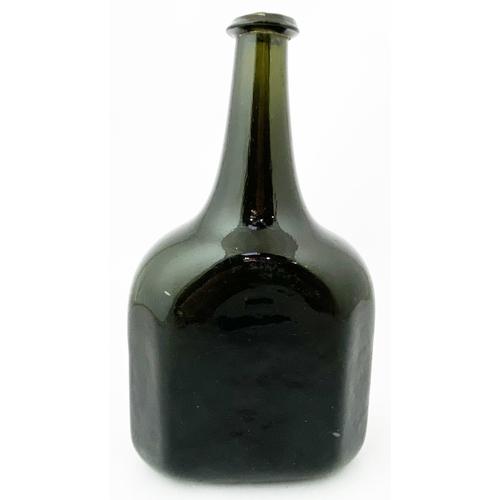 215 - ENGLISH OCTAGONAL WINE BOTTLE. 8.9ins tall, very dark green, virtually true black, glass, c. 1735-45... 