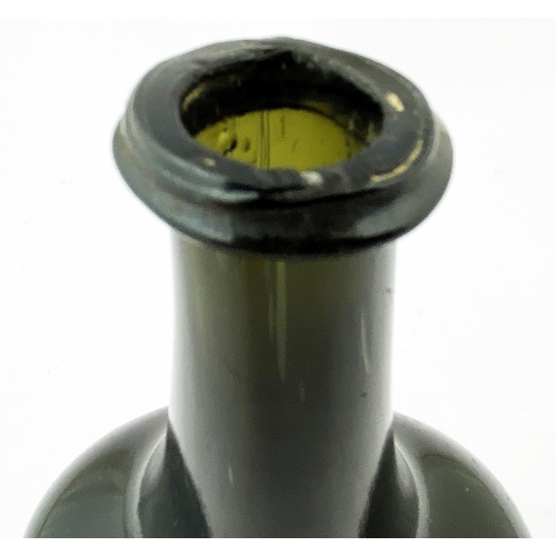 215 - ENGLISH OCTAGONAL WINE BOTTLE. 8.9ins tall, very dark green, virtually true black, glass, c. 1735-45... 