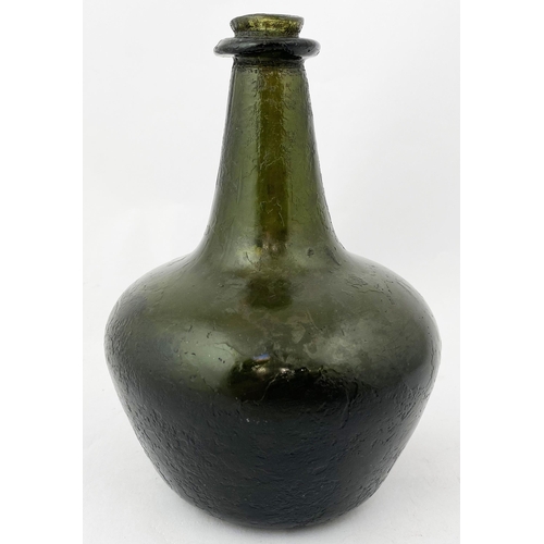 217 - ENGLISH SMALL SIZE SHAFT & GLOBE WINE BOTTLE. 6.4ins tall, dark green/ black glass, overall characte... 