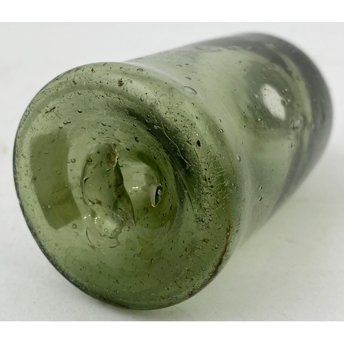 174 - FREEBLOWN APOTHECARY GLASS VIAL. 3.1ins tall. Medium green tinged glass. Wide main body, short outwa... 