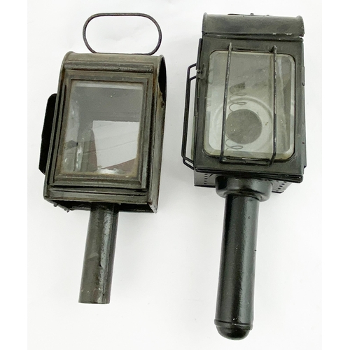 394 - HANDHELD LAMP DUO. Tallest 13ins. Some faded embossing to 1. Damages. (2)