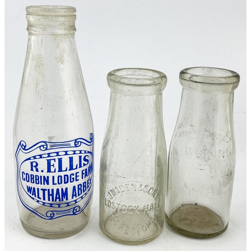 458 - ADVERTISING MILK BOTTLES & CRATE. Largest 11.5ins. Blue transfer  embossed. Waltham Abbey, Stretford... 