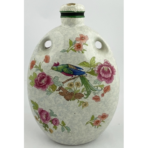 604 - THE MECCA FOOT WARMER. 11.25ins. Multicoloured floral pattern bird to both sides, + stopper. Base p.... 