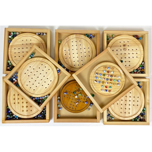 496 - SOLITAIRE GROUP. Variety of wooden boards with mix of marbles. (8)