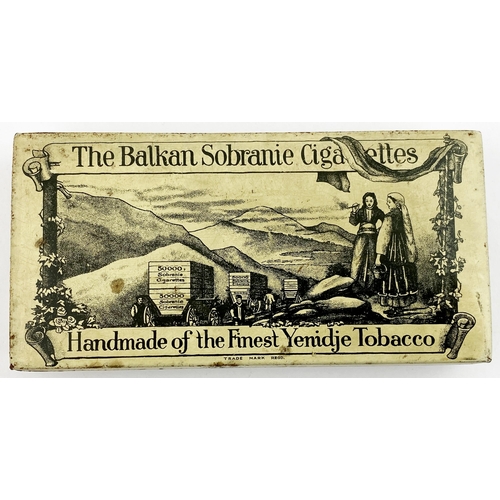 411 - BALKAN SOBRANIE CIGARETTE BOX DUO. Largest 6 x 4ins. Off white, black transfer, underside paper labe... 