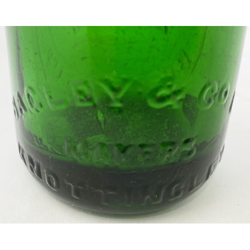 507 - SCARBORO & WHITBY GREEN CODD. 7.5ins tall. Emerald green glass, heavily embossed. Inner lip damage.