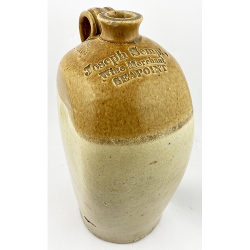 7 - IRISH FLAT SIDED FLAGON. 12.9ins tall. Flat sided t.t. flagon, rear handle, cork lip. Three lines im... 