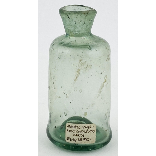 36 - FREE BLOWN APOTHECARY PHIAL. 2.75ins tall small cylinder similar to previous lot but wider bodied, d... 