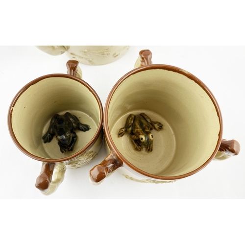 121 - BOURNE DENBY LOVING CUP TRIO, TWO WITH FROG INSERTS. 5.9ins tall, t.t. - red brown top, lower cream/... 