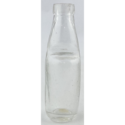 125 - MINIATURE CODD BOTTLE. 65mms tall. Clear glass mini codd bottle shape, no marble. Actually a cure pr... 