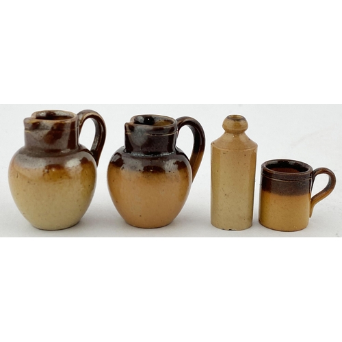 126 - MINIATURE DOULTON (UNMARKED) POTTERY GROUP. Tallest (g.b) 27mms tall. Two handled jugs, 1 tankard (a... 
