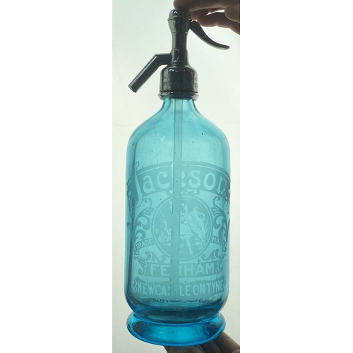 137 - NEWCASTLE SODA SYPHON. 11.9ins tall, shiny (slight wear) top, light blue, footed. Acid etched boldly... 
