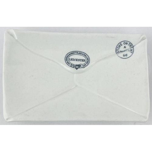 174 - LEICESTER ADVERTISING CHANGE DISH. 6.1 x 3.8ins. Shallow white envelope shaped glazed dish. Buckled ... 