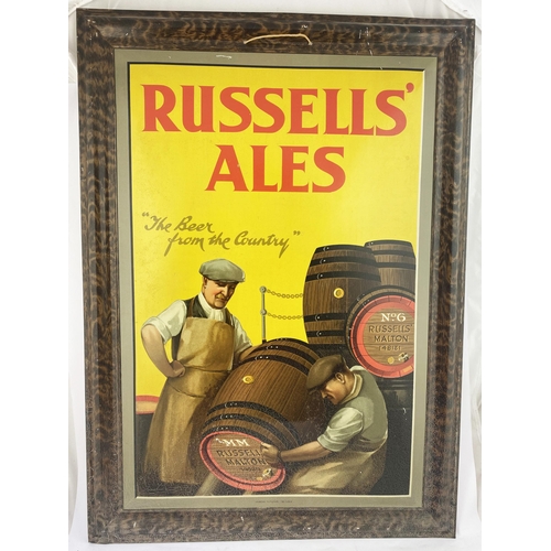 1 - RUSSELLS ALES PRESSED TIN SIGN. 21.25 x 29.5ins. Self framed design, original string hanger. Two men... 