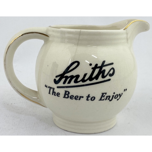 5 - SMITHS BEER PUB JUG. 3.7ins tall. Multicoloured red cheeked jolly gent enjoying a pint one side, to ... 