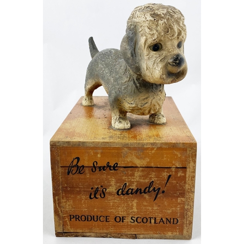 30 - DANDY DINMONT ADVERTISING FIGURE. 9.9ins tall. Composite dog model atop a wooden plinth with adverti... 