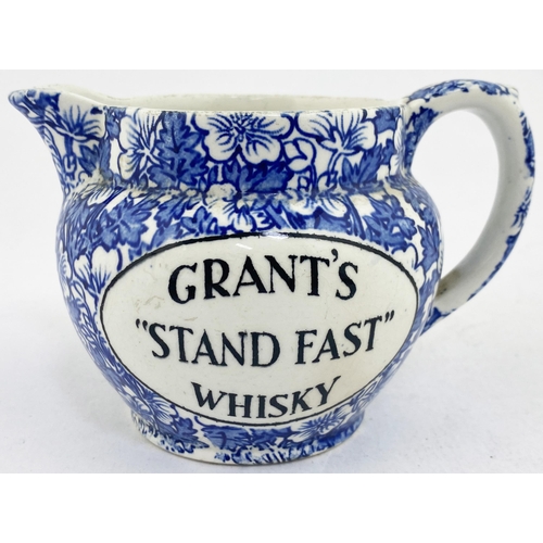 57 - GRANTS STAND FAST WHISKY PUB JUG. 3.4ins tall. Strong blue & white body transfer with black lettered... 