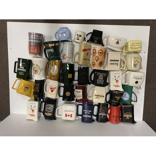 65 - PUB JUG GROUP.  Large mixed selection of pub jugs. Various drink related & cigarettes. (35) Not suit... 