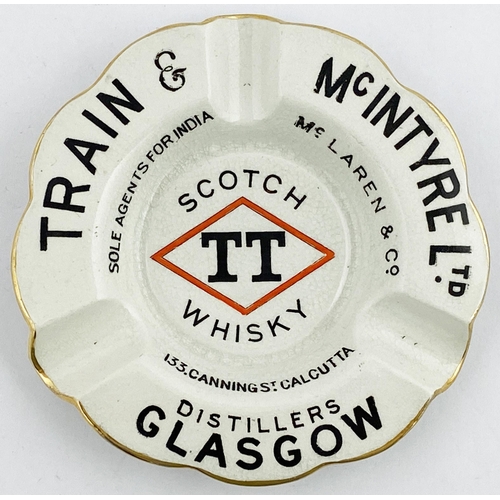 67 - GLASGOW TRAIN & McINTRYE SCOTCH WHISKY ASHTRAY. 4.6ins diam, scalloped edges, intact gold band, larg... 