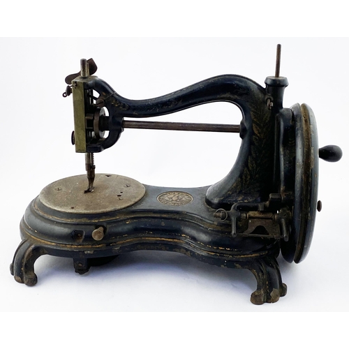 100 - JONES HAND MACHINE CAST IRON SEWING MACHINE. 10.25ins tall. Superb heavy Victorian cast iron machine... 