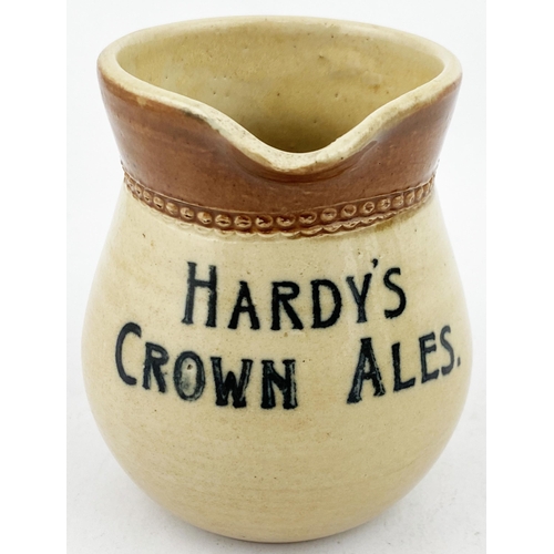 104 - HARDYS CROWN ALES WATER JUG. 3.5ins tall. T.t. stoneware small size jug. Price Bristol p.m. tucked a... 