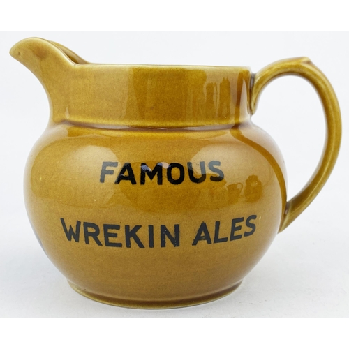 106 - FAMOUS WREKIN ALES WATER JUG. 4.2ins tall. Rusty mustard body transferred both sides with wording, j... 