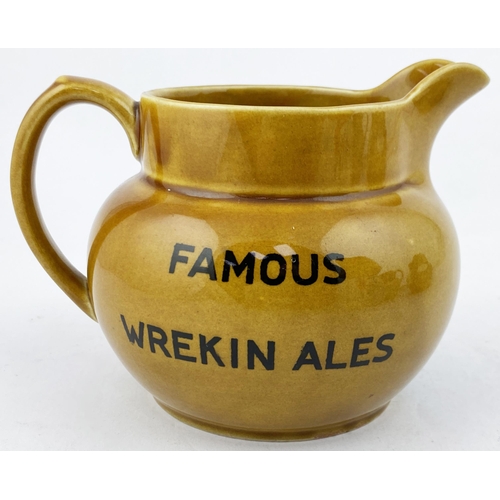 106 - FAMOUS WREKIN ALES WATER JUG. 4.2ins tall. Rusty mustard body transferred both sides with wording, j... 