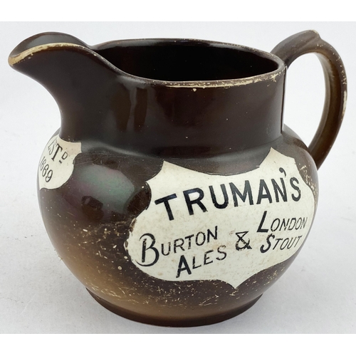 109 - TRUMANS BURTON ALES & LONDON STOUT WATER JUG. 4.3ins tall. Brown body (worn) Transferred both sides ... 