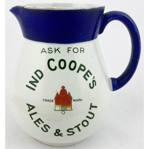 115 - IND COOPES ALES & STOUT WATER JUG. Blue top & handle, transfer both sides featuring red building (on... 