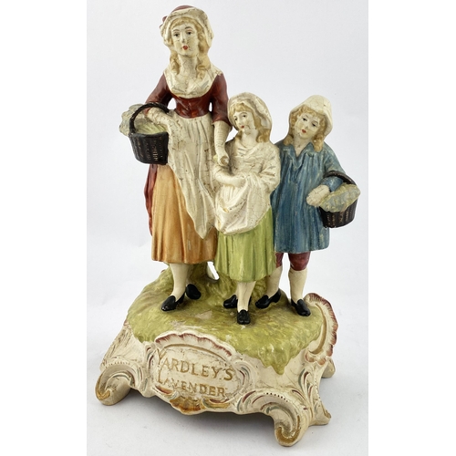 124 - YARDLEYS LAVENDER RUBBEROID ADVERTISING FIGURE. 11.7ins tall, hollow rubberoid construction. Lady wi... 