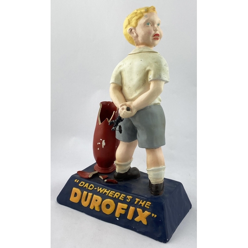 145 - DUROFIX ADVERTISING STATUETTE. 15.2ins tall. Plaster model of period dressed young boy declaring DAD... 