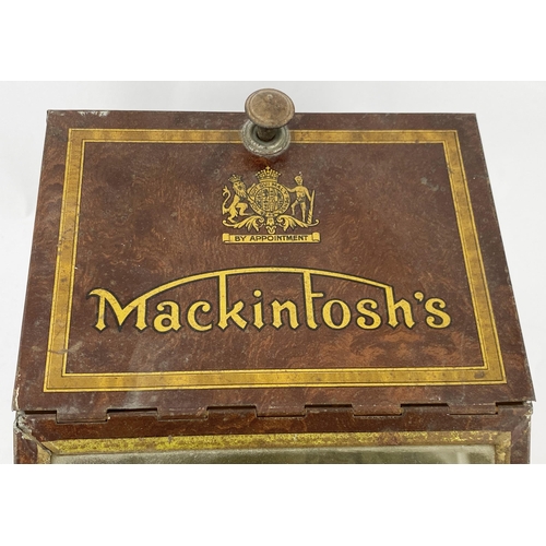 95 - MACKINTOSHS SHOP COUNTER DISPENSING TIN. 8 x 16 x 6.3ins. Wedge shaped tin with angled glass front, ... 