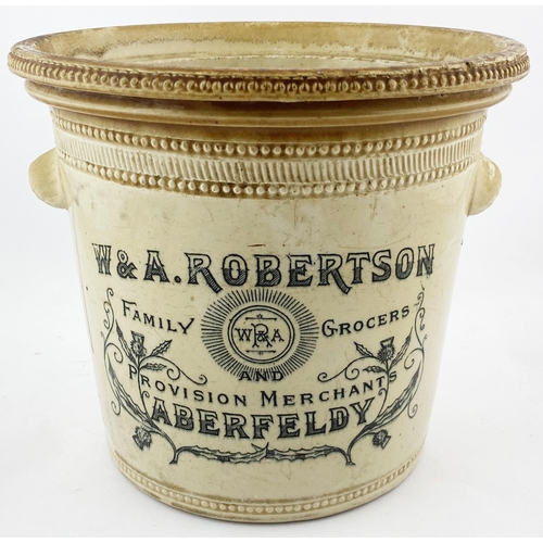 15 - ABERFELDY BUTTER CROCK. 8ins tall. Tan rim,wheeled decoration to bottom & top edge, two side handles... 