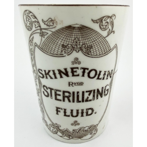 25 - SKINETOLIN STERILISING FLUID BEAKER. 4.5ins tall. Outward tapering shape, dark brown front transfer,... 