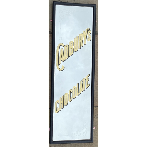 70 - CADBURYS CHOCOLATE MIRROR. 15 x 48ins matt black wooden frame. Gold speckle effect lettering diagona... 