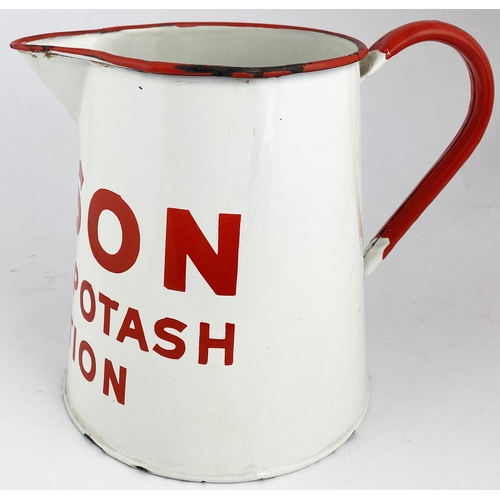 84 - ENAMELLED POTASH SOLUTION JUG. 8ins tall. Metal handled jug, bright red rim, handle & lettering. Ena... 