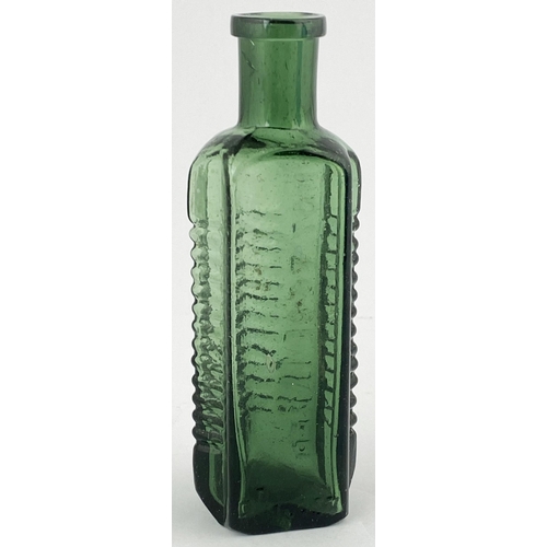 85 - STAR POISON BOTTLE. DP p58. 4.5ins tall, green glass, vertically embossing between ribbed panels, ba... 