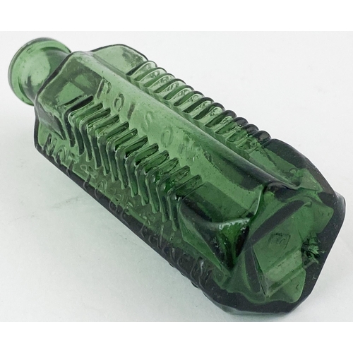 85 - STAR POISON BOTTLE. DP p58. 4.5ins tall, green glass, vertically embossing between ribbed panels, ba... 