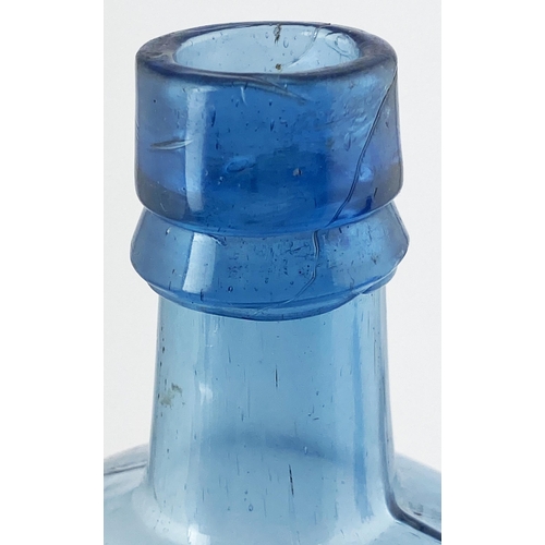 87 - G. HANDYSIDES BLOOD FOOD BOTTLE. 10ins tall. Ice blue glass. Long neck, sloping shoulders, embosse B... 