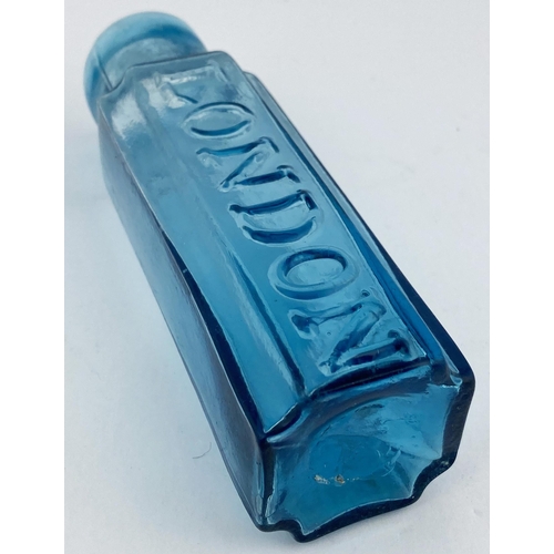 91 - LONDON MUSTARD BOTTLE. 5.25ins tall. Light turquoise/ blue glass, square bodied, curved inward facet... 