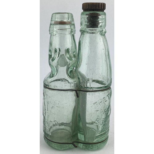 118 - SCHONS TWIN BOTTLE PATENT. 7.25ins tall. Two aqua glass mineral type bottles wired together one a Ni... 