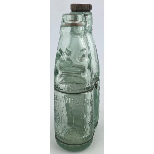 118 - SCHONS TWIN BOTTLE PATENT. 7.25ins tall. Two aqua glass mineral type bottles wired together one a Ni... 